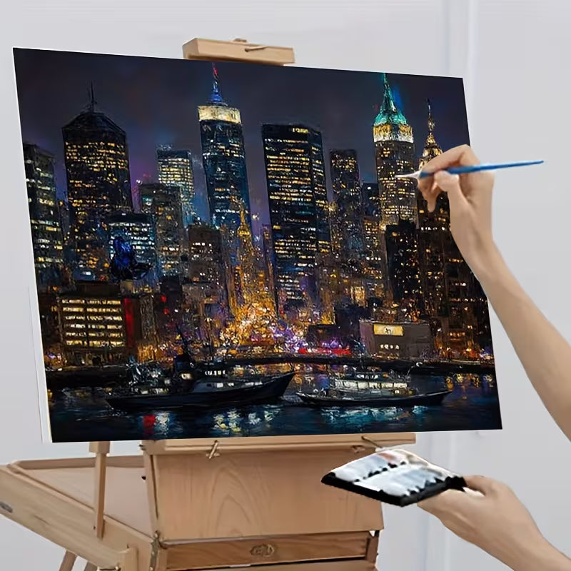 Процес на рисуване по номера с нощен градски пейзаж и осветени небостъргачи