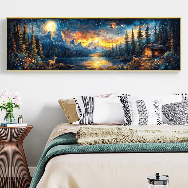 Панорамна картина в рамка с планински пейзаж, езеро, елени и къщичка под лунна светлина, подходяща за елегантна стенна декорация в спалня или дневна.